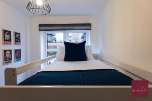 a bed in a room with a window at Hook Three Bed Flat Parking in Hook