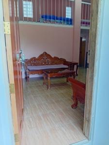 an open door to a living room with a couch at cavinitan transient house in Virac +4 photos