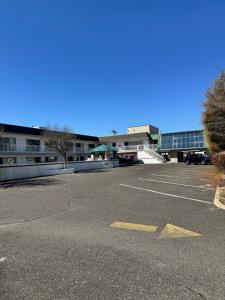 an empty parking lot in front of a building at Impala Island Inn in Ocean City