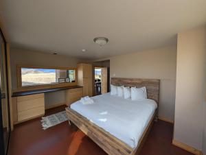 a bedroom with a large bed and a window at Erik's Ranch in Livingston