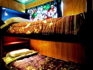 Cama o camas de una habitación en La Casa Azul Hostel