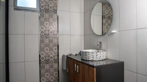 a bathroom with a sink and a mirror at We Nirvana Otel in Mezitli +34 photos