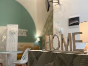 a sign that says love sitting on top of a table at Pepe 25 in Ruvo di Puglia