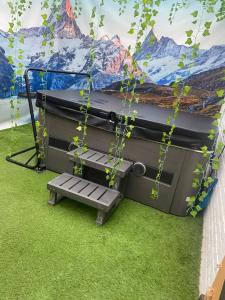 a play structure with a bench and a mural at Chambre avec spa privatif in Amiens