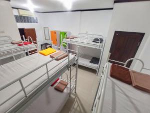 a room with two bunk beds in a hospital at I am Backpacker Hostel in Sabang +34 photos