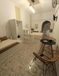 a large living room with a bed and a chair at Overhill Apartments Adamas in Adamantas +48 photos
