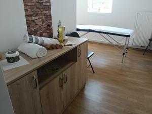 a kitchen with a wooden counter top in a room at Casa Hermina in Sovata