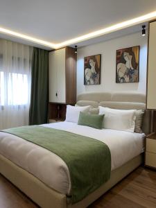 a bedroom with a large bed with white pillows at Sky View by Luxurious Holidays in Rabat +81 photos