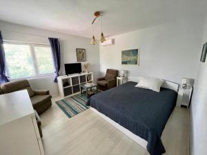 a bedroom with a bed and a living room at Vila 'Anna' in Krapets +14 photos