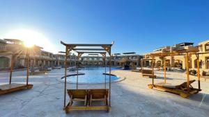 a resort with a swimming pool in a courtyard at vip ghazala in Dahab