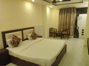 a bedroom with a large bed in a room at Hotel Alpine in Chandīgarh