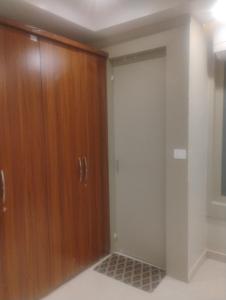 a closet with a wooden door in a room at Vihangam vatika in Sasarām