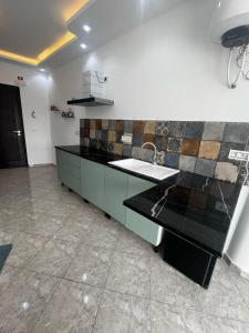 a kitchen with a sink and a counter top at L Andalousie in Tabarka +8 photos