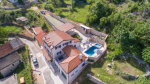 an aerial view of a house with a swimming pool at Villa Argenta in Aržano +44 photos