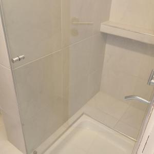 a shower with a glass door in a bathroom at Panchitas in Guaymallen
