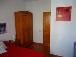 Łóżko lub łóżka w pokoju w obiekcie Apartamentos Flor del Cotillo