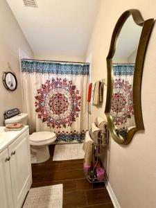 a bathroom with a toilet and a shower curtain at Ruskin FL 2 bdrm 1 bath suite Host & Cat share common areas in Ruskin +72 photos