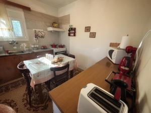 a kitchen with a table and a kitchen with a counter top at Georgaras Accommodation in Platanoússa +36 photos