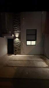 a dark room with a window in a building at Loft Horizonte Viedma in Viedma