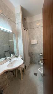 a bathroom with a sink and a toilet at UNITY BANK HOTEL Termale Padova RC12 in Abano Terme +37 photos