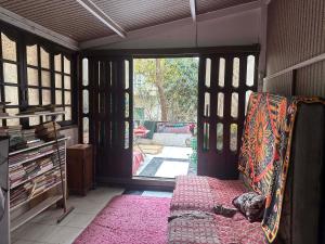 a dog laying on a couch in front of a door at Baraka in Cairo