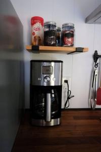 a coffee maker sitting on a counter in a kitchen at Lilys Little Lodge in Blairmore