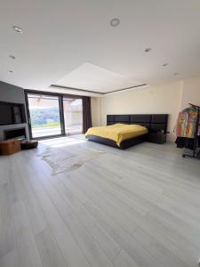 a large bedroom with a bed and a large window at Villa Meg with Private Pool, Sauna Jacuzzi in Kadıköy +42 photos
