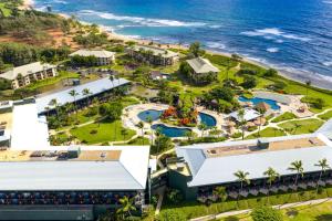 an aerial view of the resort and the ocean at Pristine Hotel Room at Popular Resort in Lihue