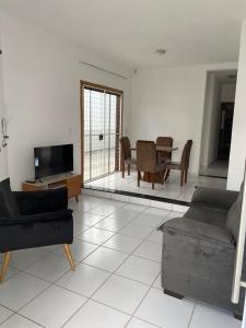 a living room with a couch and a table at Espaço Guga in Sorocaba