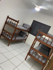 a room with two bunk beds and a ladder at Espaço Guga in Sorocaba