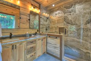 a bathroom with a sink and a shower at Altitude Adjustment- Luxury 3BR Cabin w/ Outdoor Living Area & Hot Tub in Epworth +37 photos