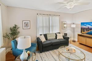 a living room with a couch and a table at USS Alexandria in Highwood
