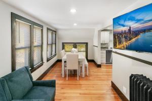 a living room with a table and a couch at USS Maddox in Libertyville +15 photos