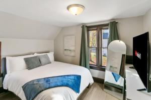 a bedroom with a large bed and a window at USS Maddox in Libertyville