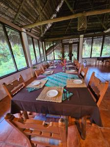 a long dining room with a long table and chairs at Creekside Oasis in San Felipe
