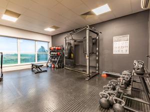 a fitness room with a gym with weights at 2 Bed in Saltash oc-87705 in St. Mellion