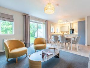 a living room with a table and chairs at 2 Bed in Saltash oc-87705 in St. Mellion