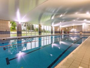 a large swimming pool in a building at 2 Bed in Saltash oc-87705 in St. Mellion