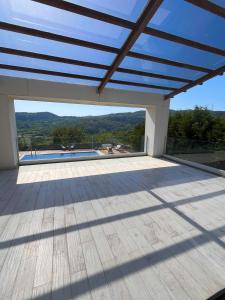 an open patio with a view of the mountains at Villa Meg with Private Pool, Sauna Jacuzzi in Kadıköy