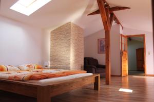 a bedroom with a bed in a room at Villa Landidyll mit wunderschönem-seperatem Wellnessbereich in Joachimsthal