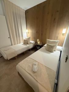 a hotel room with two beds in a room at Zen Garden Apartment in Vera +70 photos