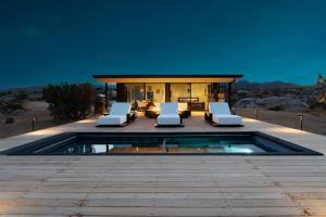 a house with a swimming pool in the desert at Atomic Ranch by Fieldtrip Secluded Pool Views in Pioneertown