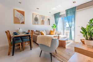 a living room with a couch and a table at Boho Dream Apartments in Ulcinj +43 photos