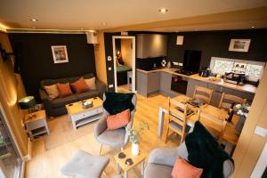an aerial view of a living room and kitchen at Wigtown by Wigwam Holidays in Newton Stewart +28 photos