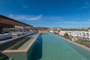 a swimming pool on the roof of a building at Punto Nima, Spectacular Pool with Ocean View in San José del Cabo