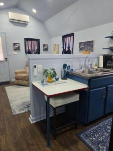 a kitchen with a sink and a counter top at The Blue Goose in Marshall