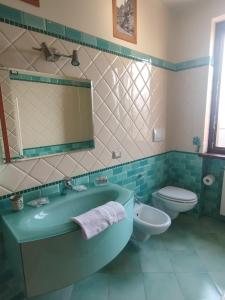 a bathroom with a tub and a toilet and a sink at Villa Roverella Sutri Home Sweet Home Viterbo in Sutri +43 photos
