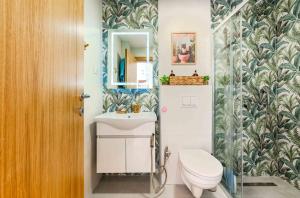 a bathroom with a toilet and a sink at Boho Dream Apartments in Ulcinj
