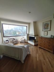 a bedroom with a large bed and a large window at Villa Roverella Sutri Home Sweet Home Viterbo in Sutri
