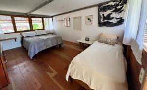 a bedroom with two beds in a room at Casa Isla - Private Retreat in Galapagos in Puerto Baquerizo Moreno